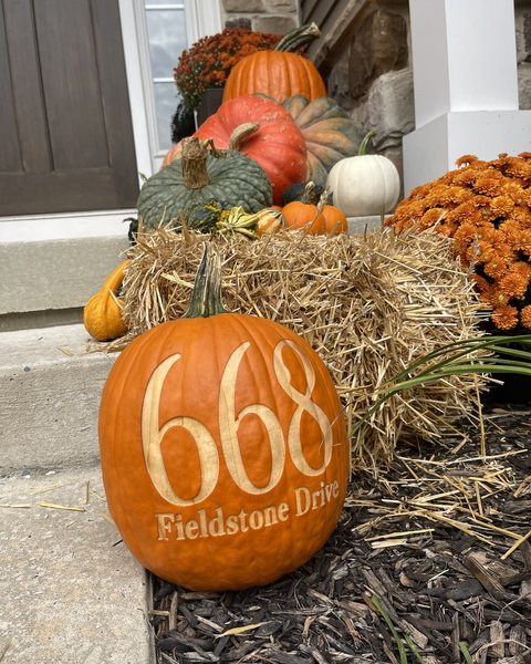 668 Fieldstone Drive, engraved as a house number on the straw bale