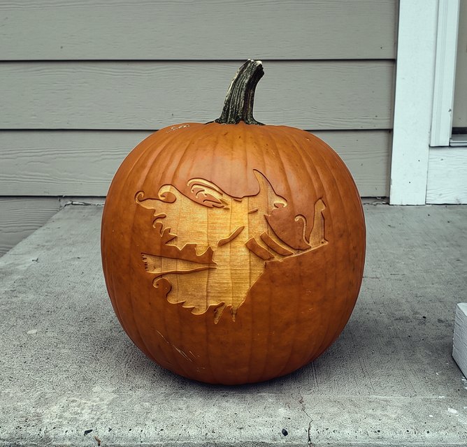 A pumpkin laser-engraved with a witch flying on a broomstick